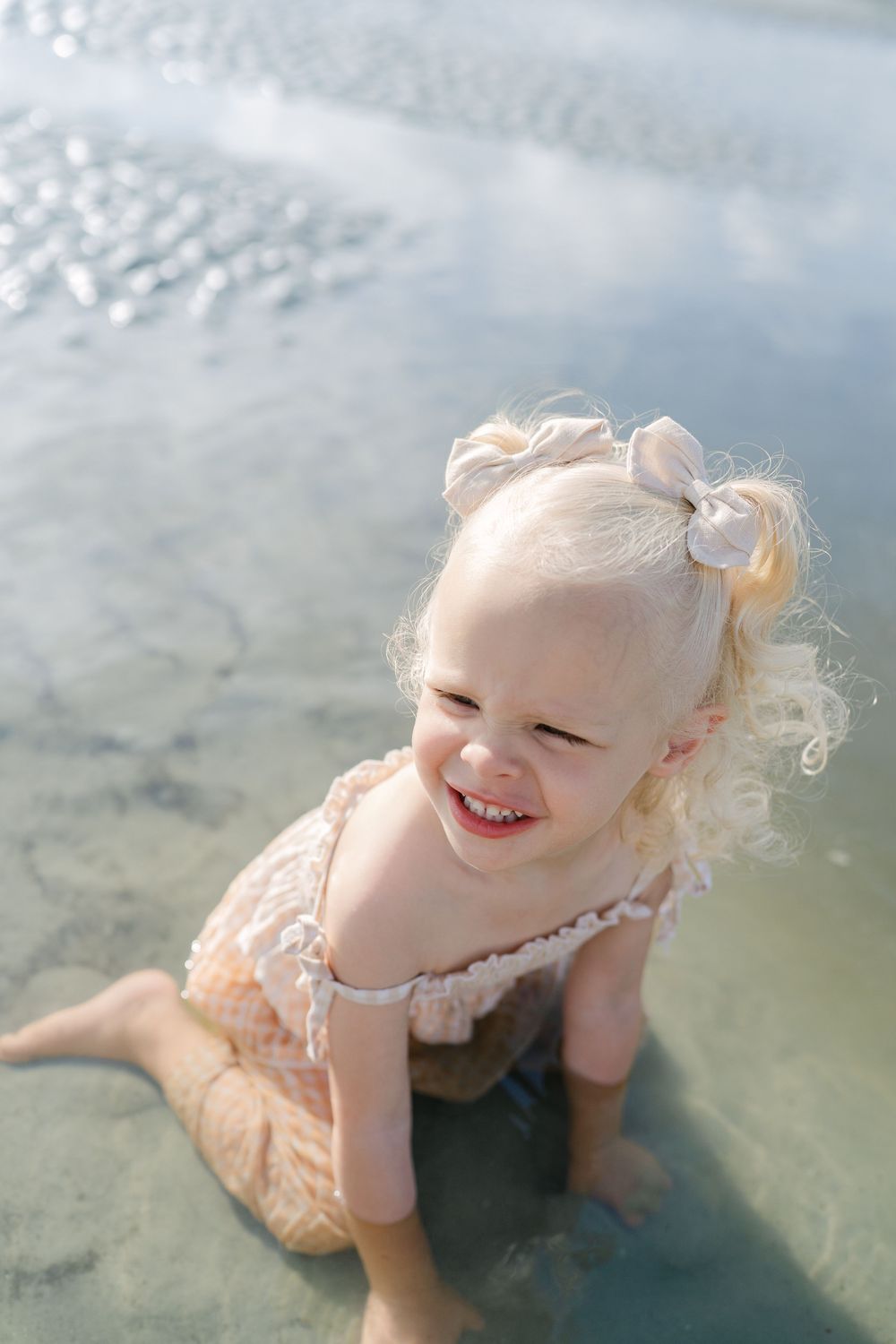 Toddler exploring the sand during a family vacation photography session on Jekyll Island with Lindy Rebro