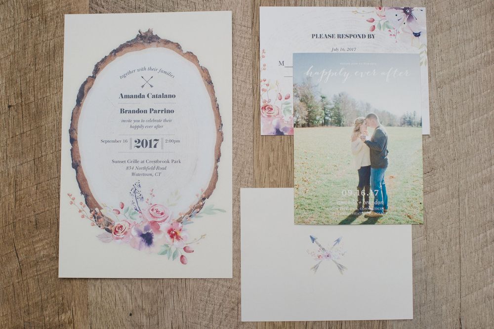 Elegant floral wedding invitation suite with watercolor flowers, an engagement photo card, and RSVP card displayed.