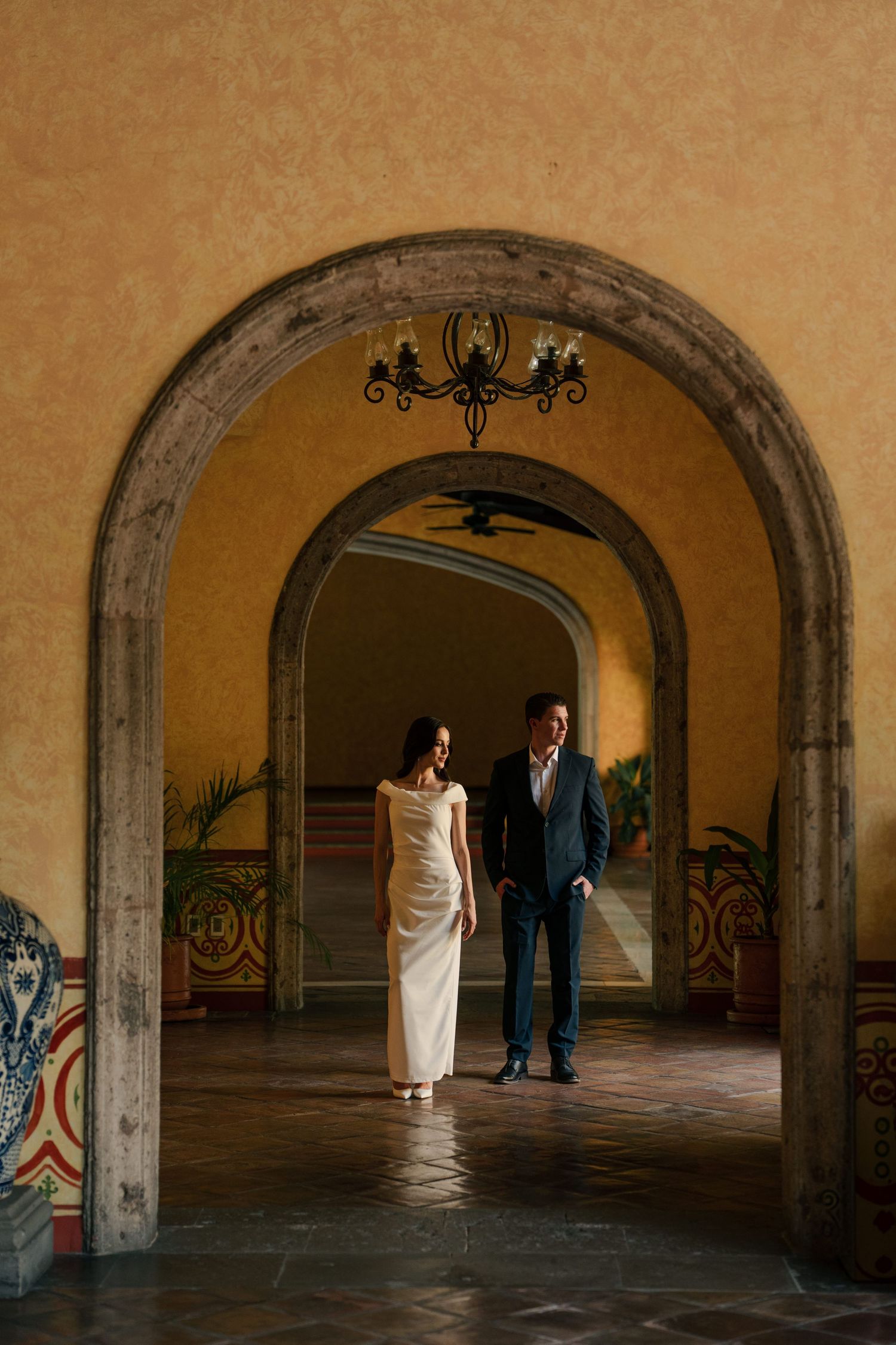 Elegant black and white wedding portraits showing tender moments between newlyweds.