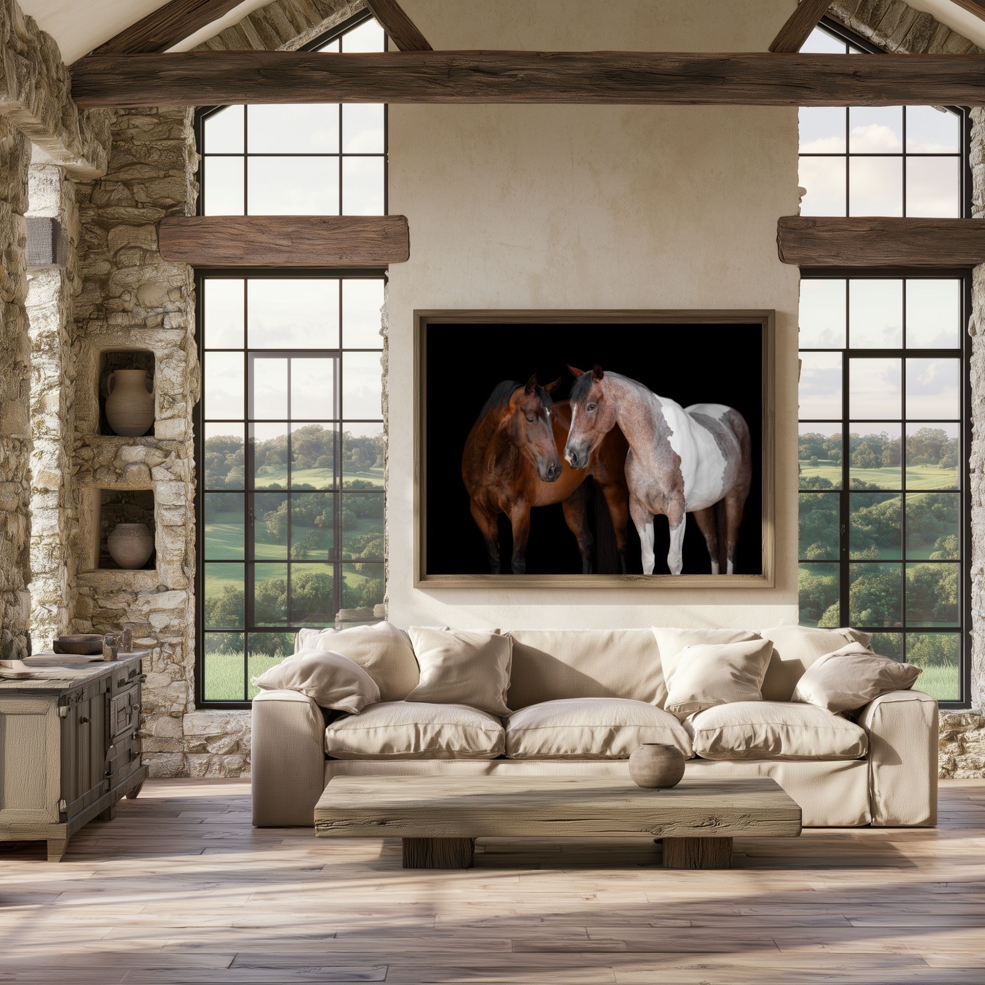 Rustic living room with stone walls featuring a large framed painting of two horses above a beige sofa.