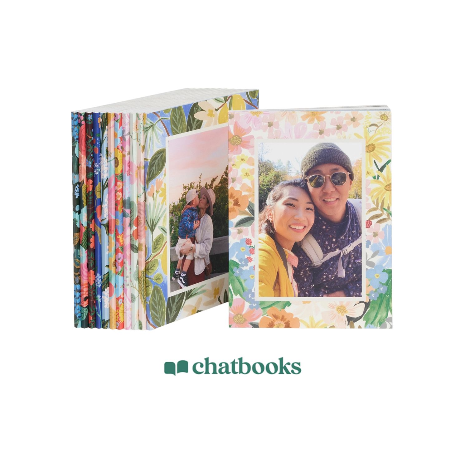 Chatbooks photo books with floral covers featuring a couple smiling, displayed in a stacked arrangement.