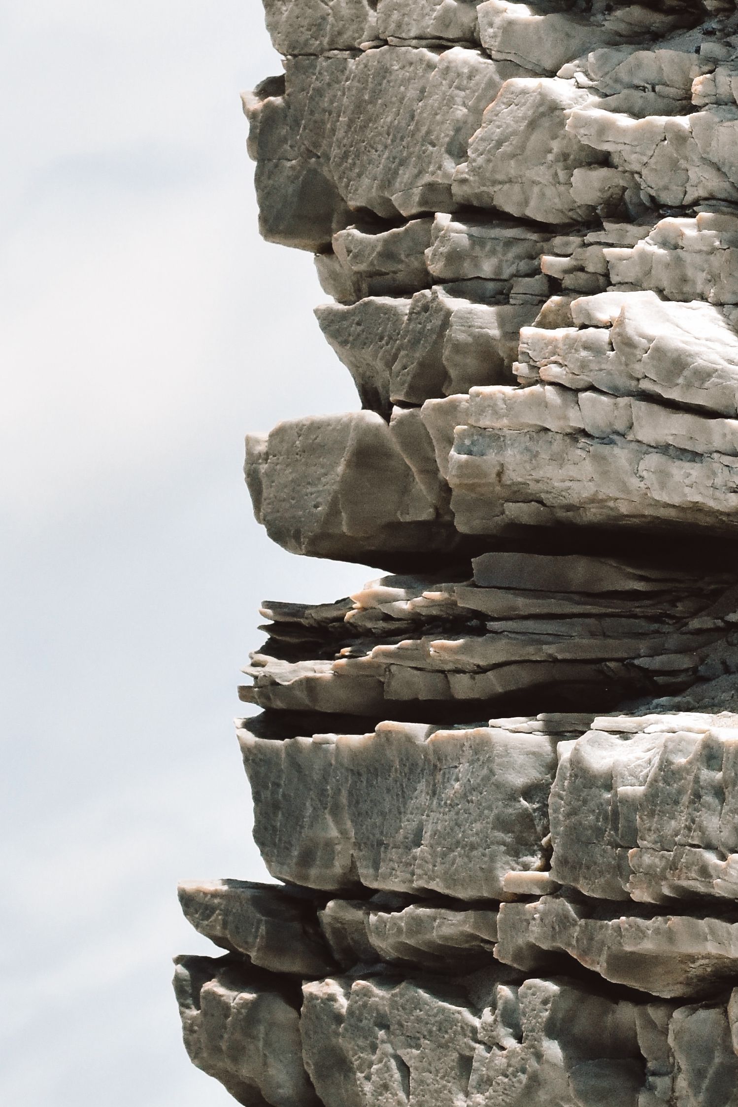 Horizontal rock layers with sky to the left