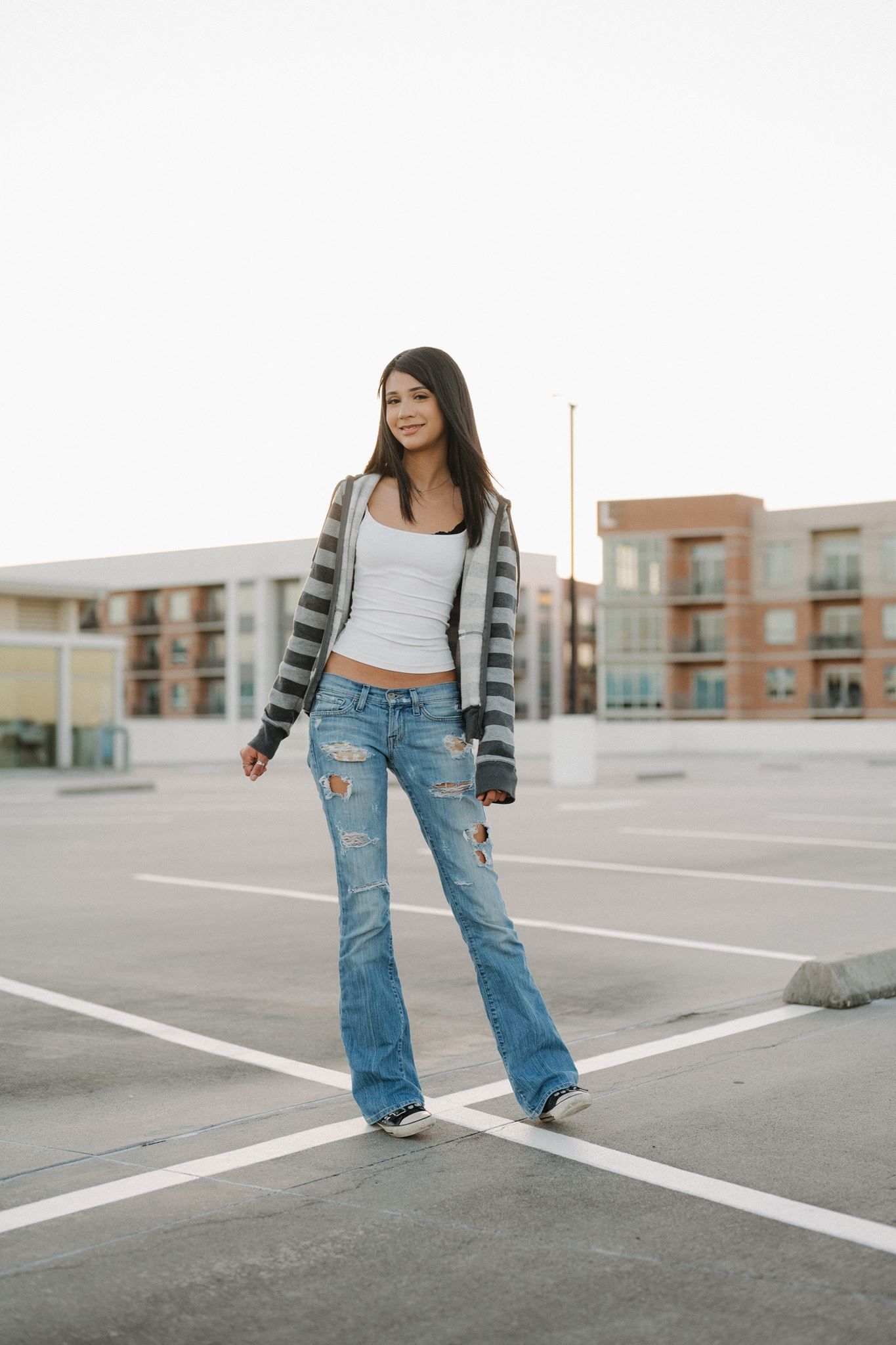 The Woodlands High School senior girl posing at a parking garage in The Woodlands Texas