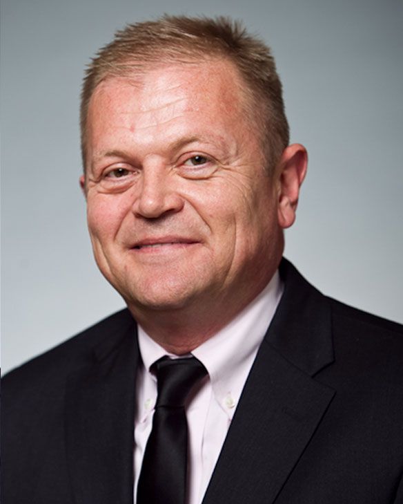 Before professional headshot example with traditional lighting and softer detail