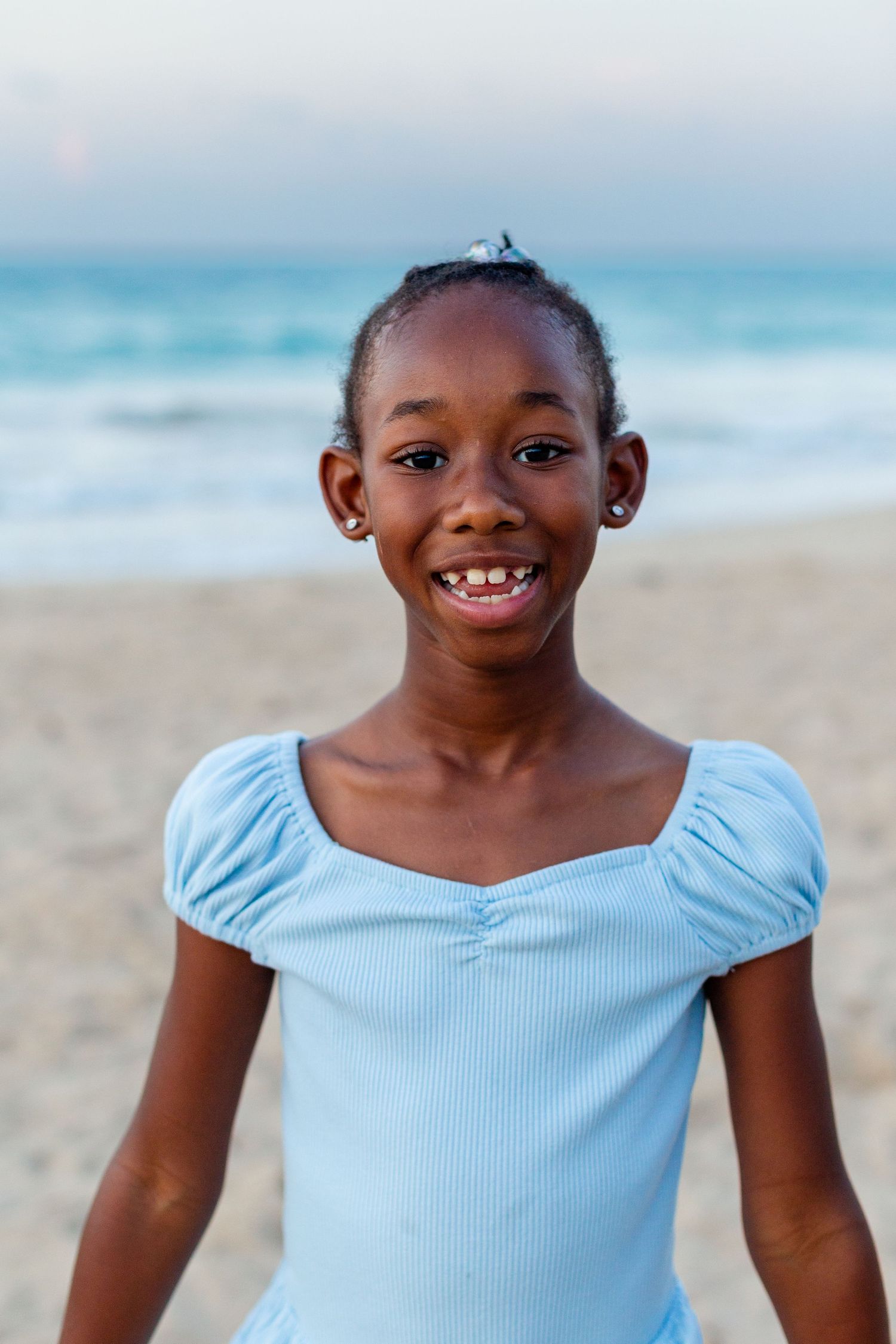 Portrait of a girl on the beach in Isla Verde, Carolina, Puerto Rico.