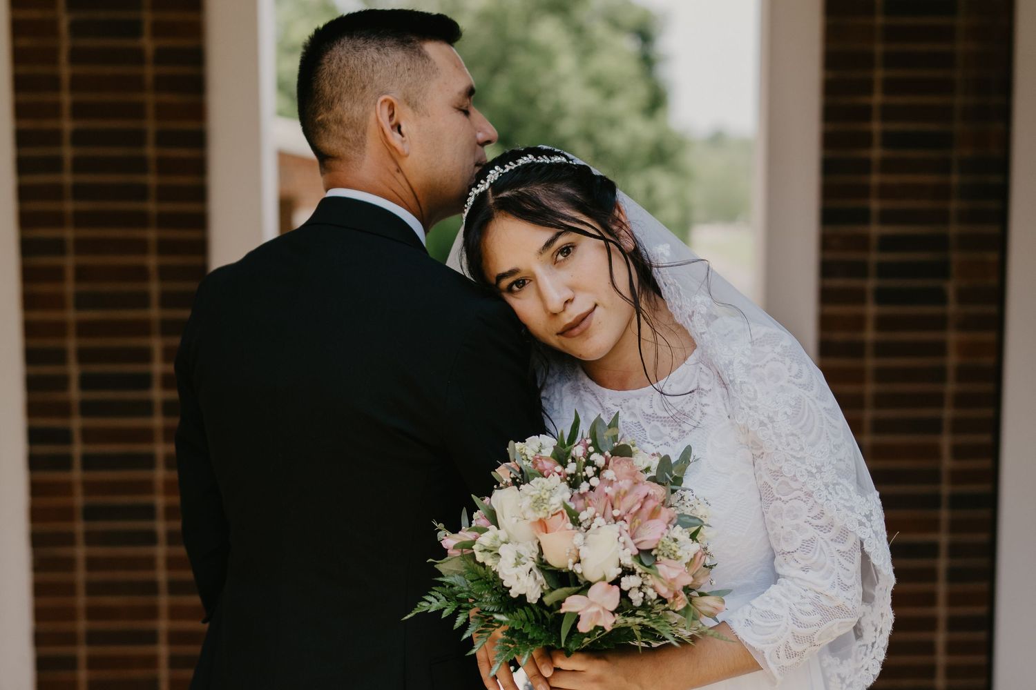 Couple embracing during first look, white dress oak ridge wedding