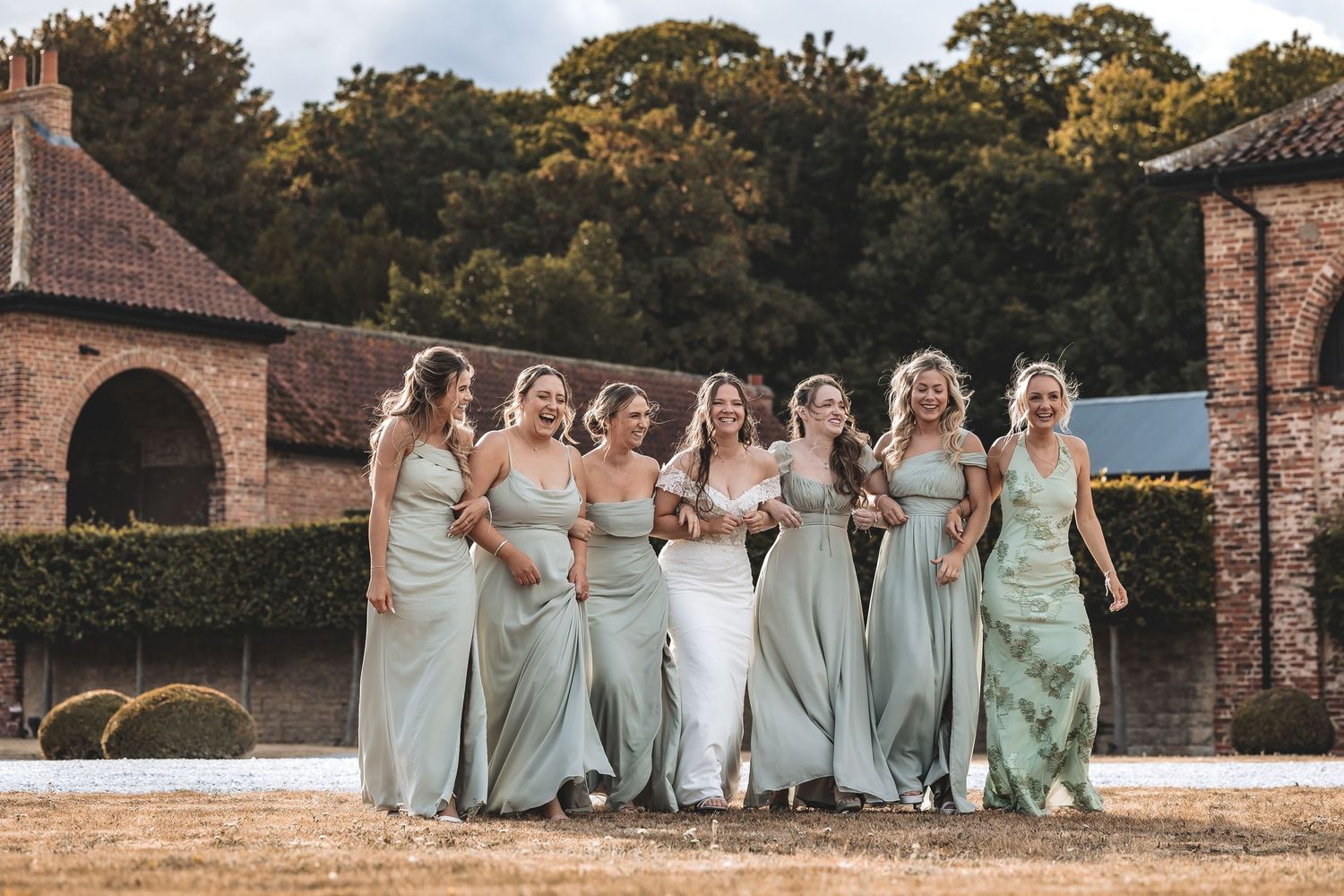 Bride laughing with bridesmaids at Hazel Gap Barn wedding