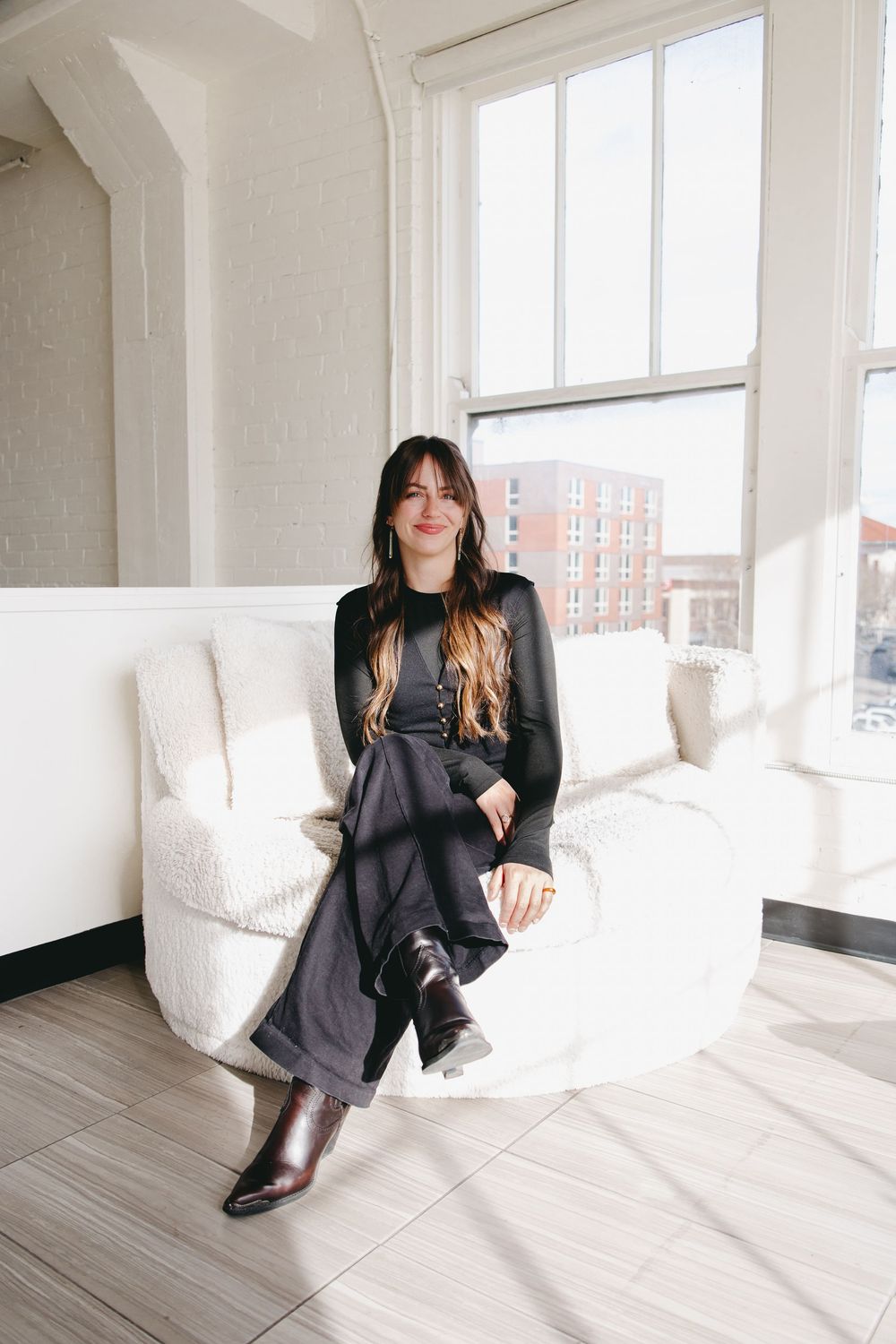 woman sitting on an oversized round chair