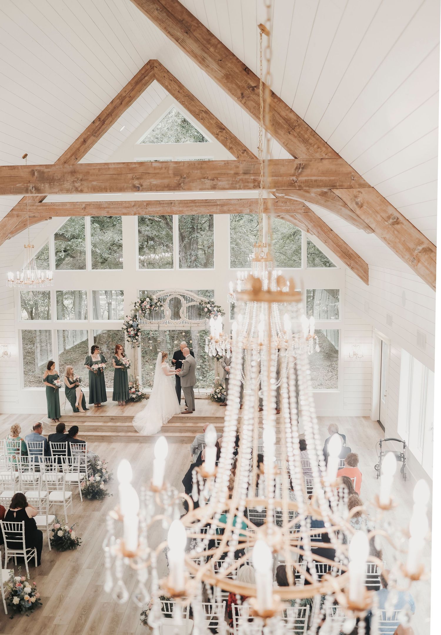 Bride and groom exchanging vows at their French Farmhouse wedding