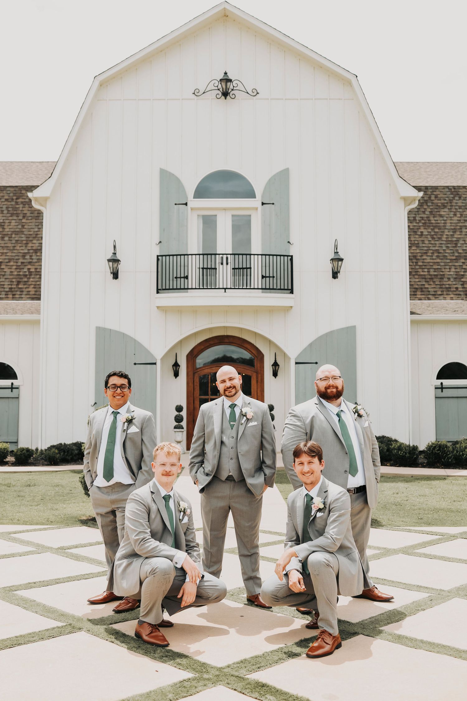 Parker and Kathryn wedding portrait in front of The French Farmhouse in Collinsville Texas