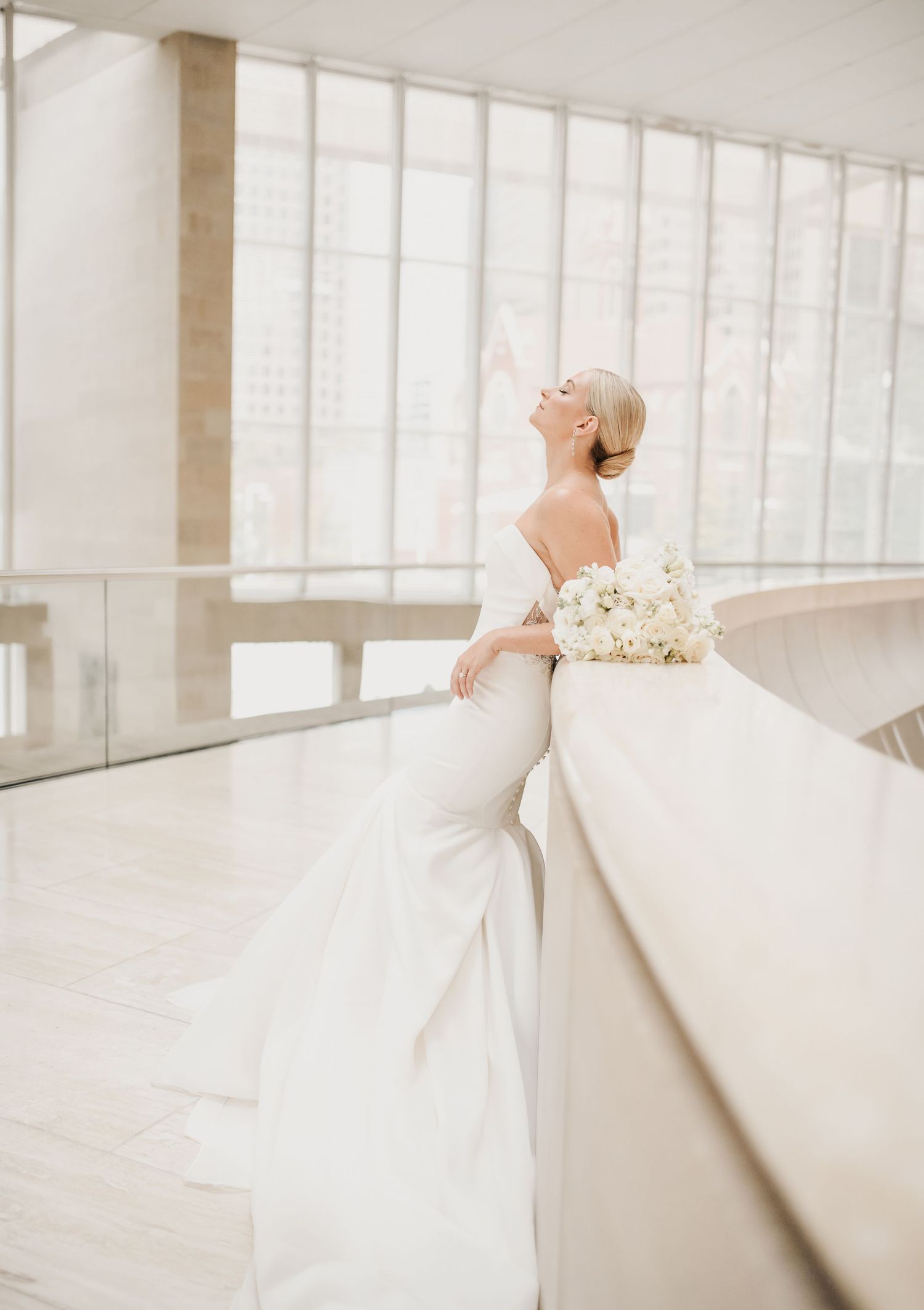 Luxury bridal photography featuring a bride and white bouquet in the Dallas Arts District