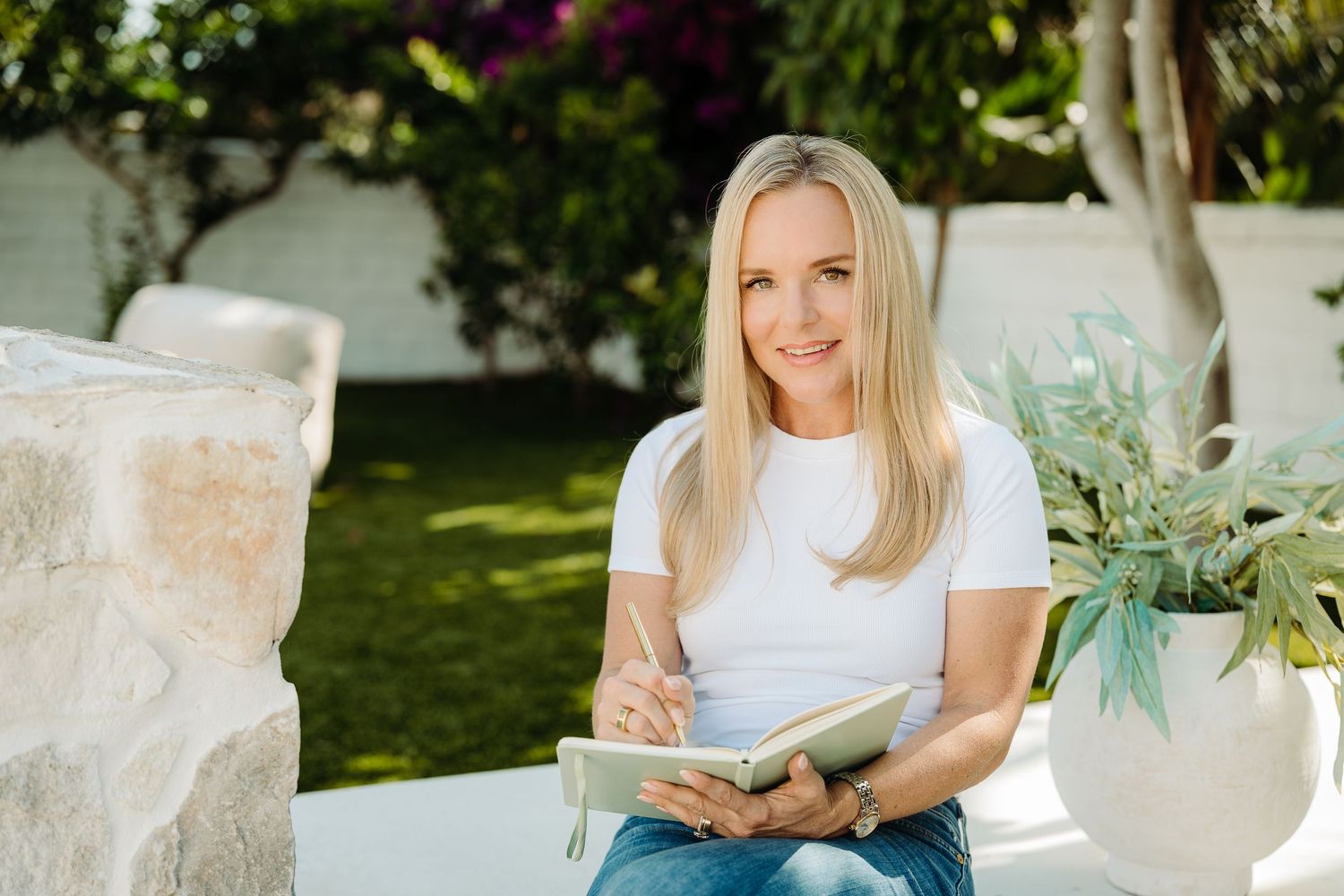 Mindset coach journals during a Mini Branding Photoshoot