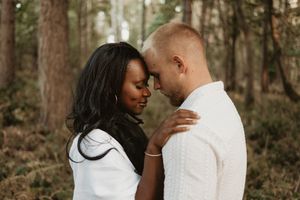 Natural close-up portrait of a couple together in the woods