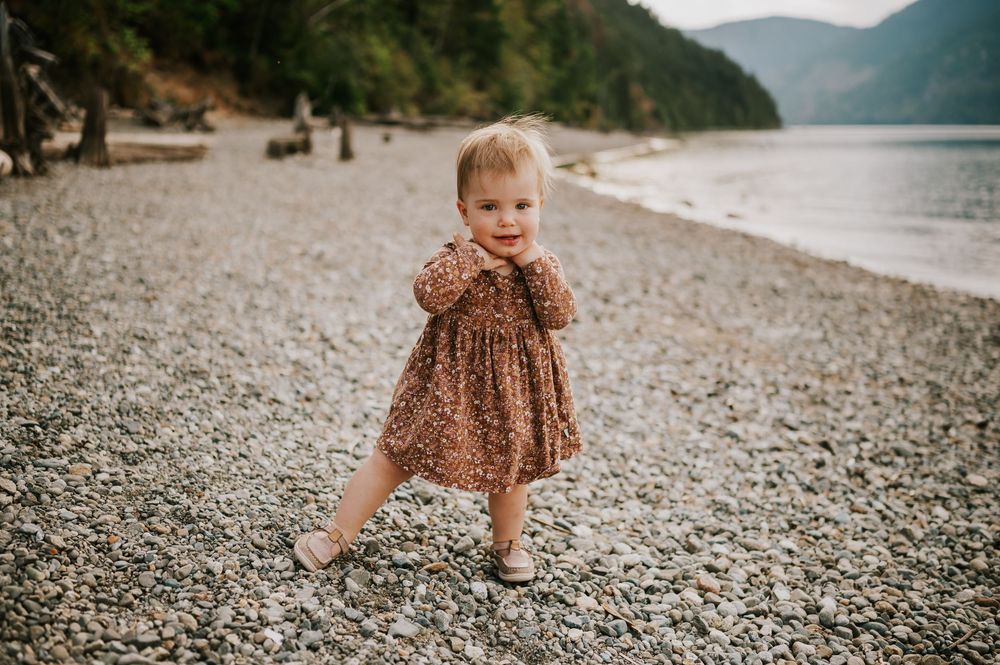 Comox Valley Photographer Portraits at Comox Lake in Cumberland, Vancouver Island. Casual and candid family photos toddler walking on beach