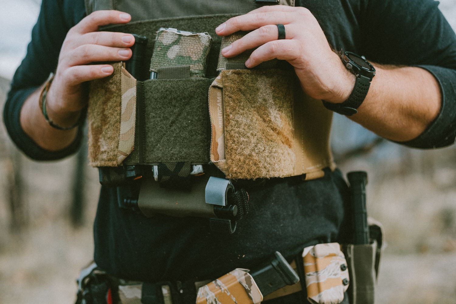 A tactical brand owner posing for a picture wearing his plate carrier and battle belt