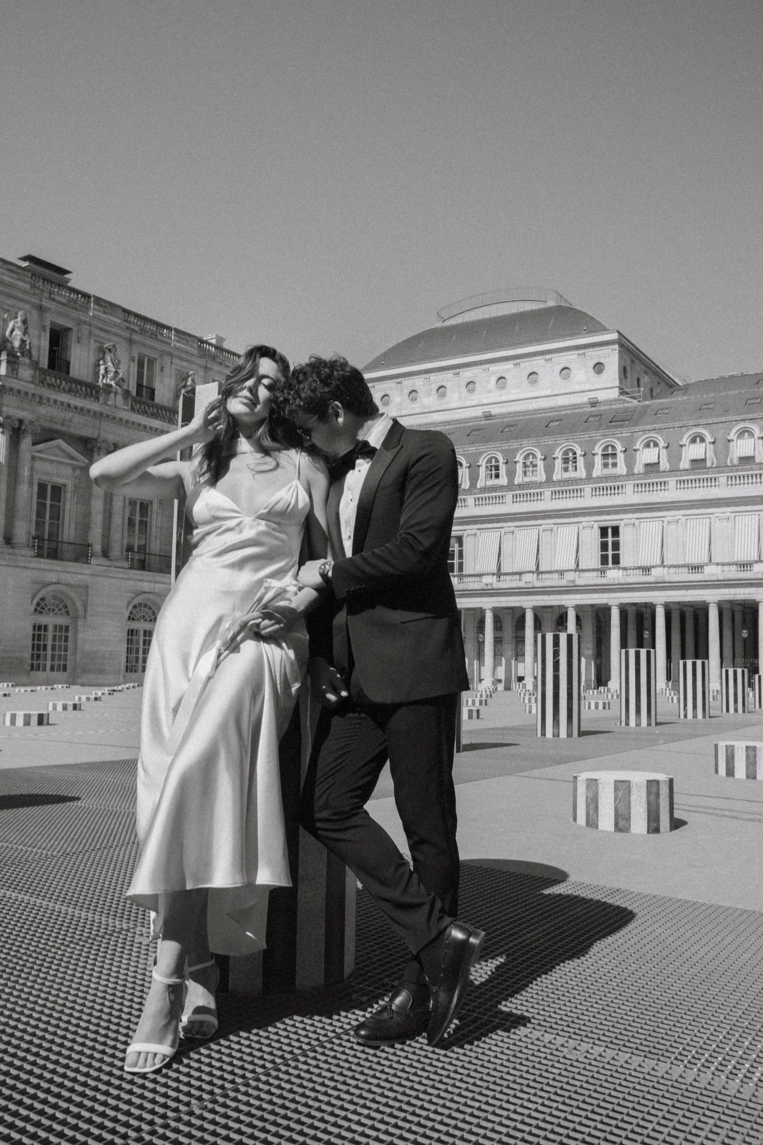 Elegant bride and groom portrayed at the Palais Royal during their stylish destination wedding in Paris, France