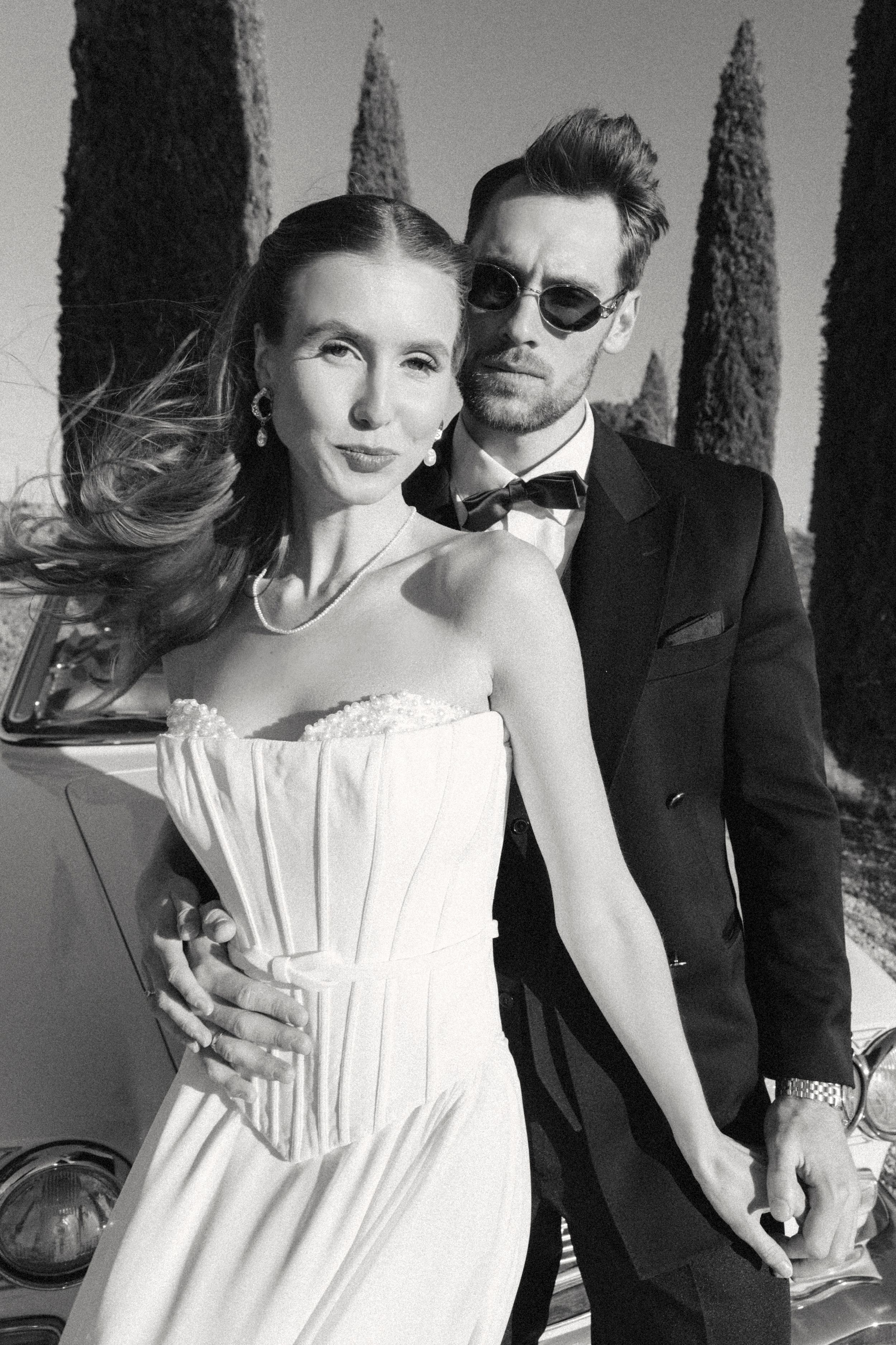 Dynamic bride and groom captured in black and white during their destination wedding in Tuscany, Italy