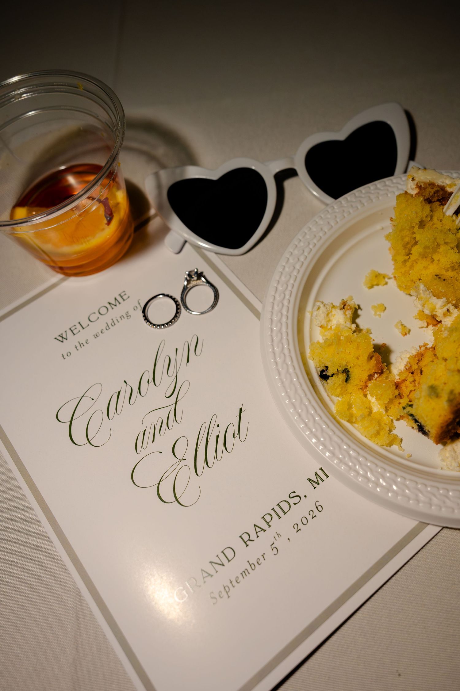 Wedding program for Carolyn and Elliot in Grand Rapids MI dated September 5 2026 with cake and drink.