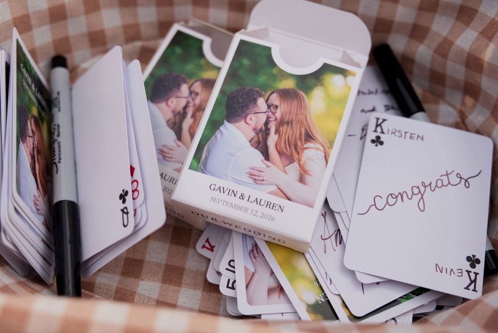 Custom deck of playing cards printed with the couple's engagement photo as a guest sign-in alternative.