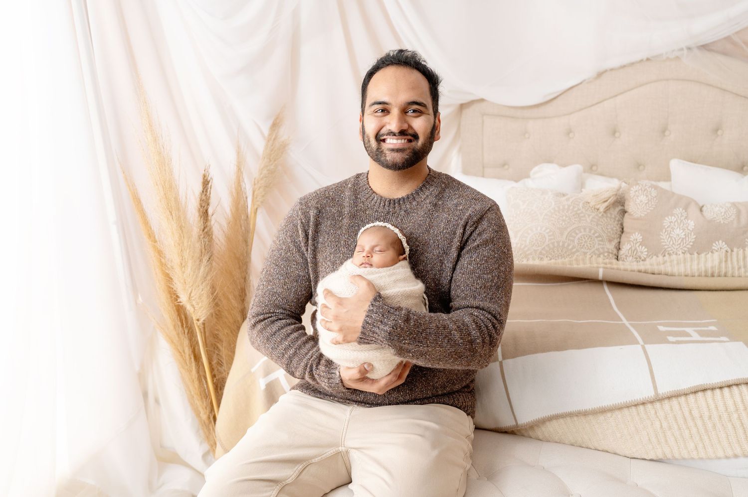 Family photoshoot in neutral tones with modern farmhouse decor elements.
