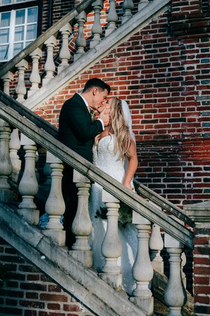 Couple shares intimate moments on stone staircase against brick wall in romantic photo sequence.