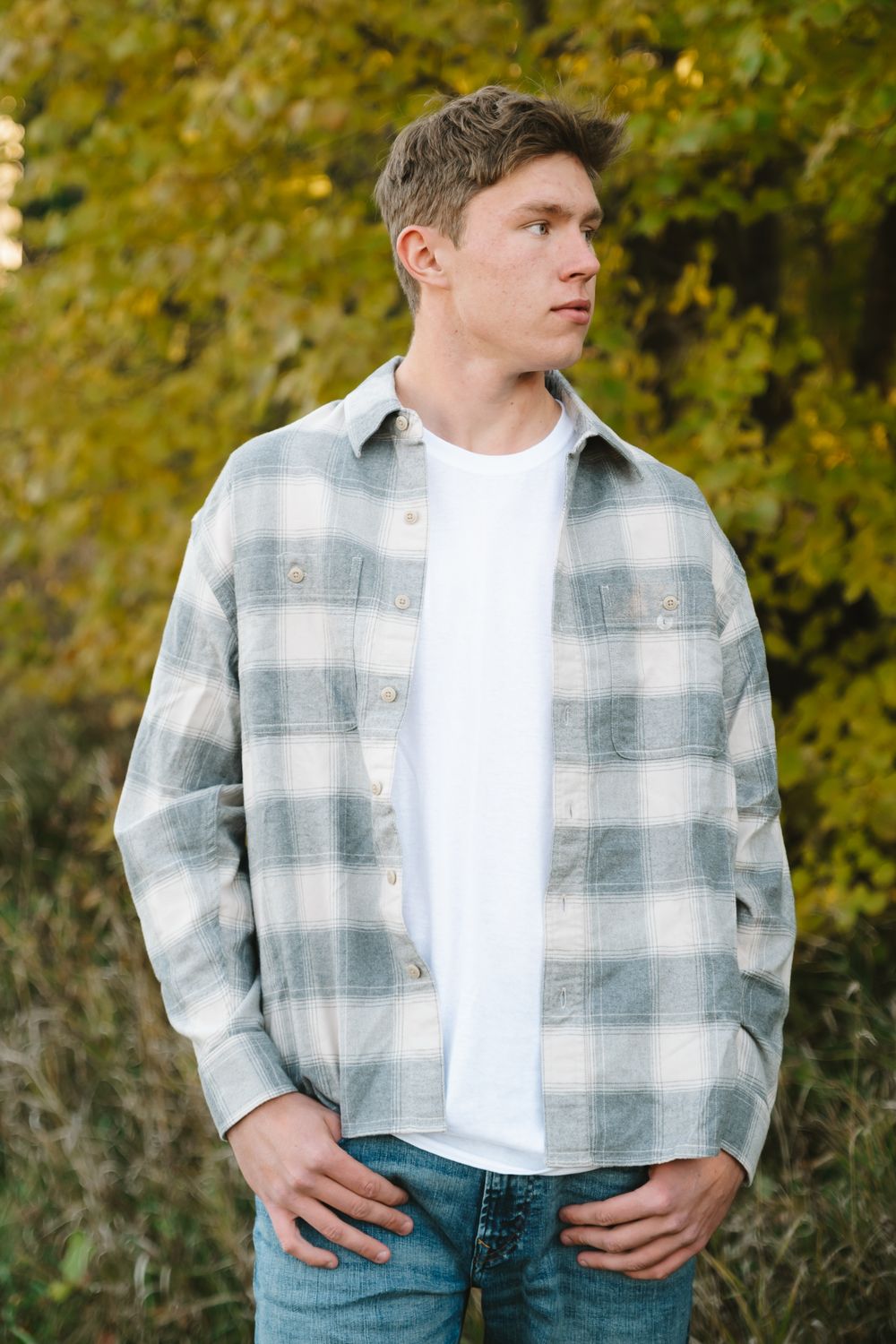 Casual outdoor portraits featuring plaid flannel shirt and white t-shirt combination.