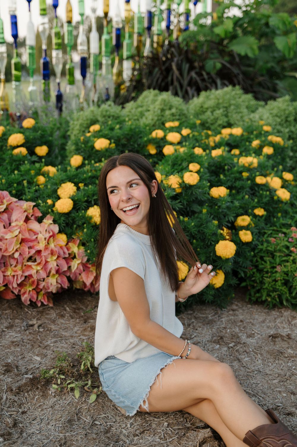 Portrait of girl in front of flowers captured in timeless, colorful style