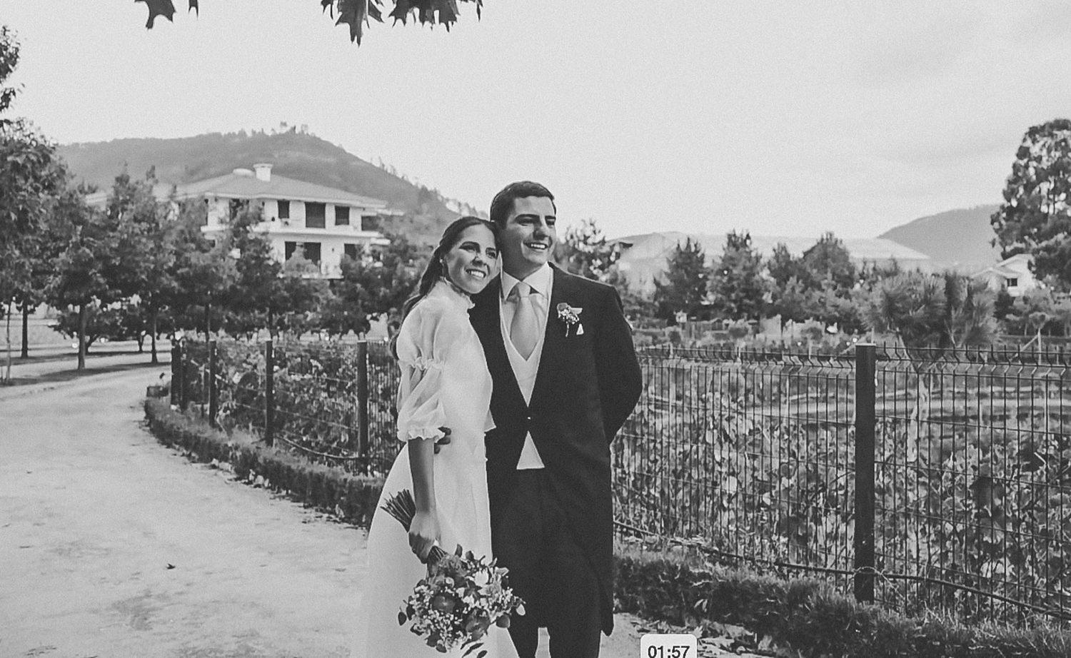 Wedding celebration with guests throwing confetti at a joyous outdoor ceremony.