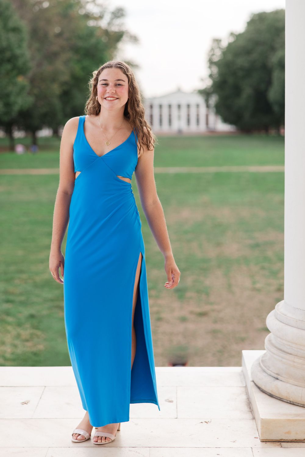 Sorority student with UVA lawn in background photographed from the Rotunda on grounds at the University of Virginia in Charlottesville, VA.
