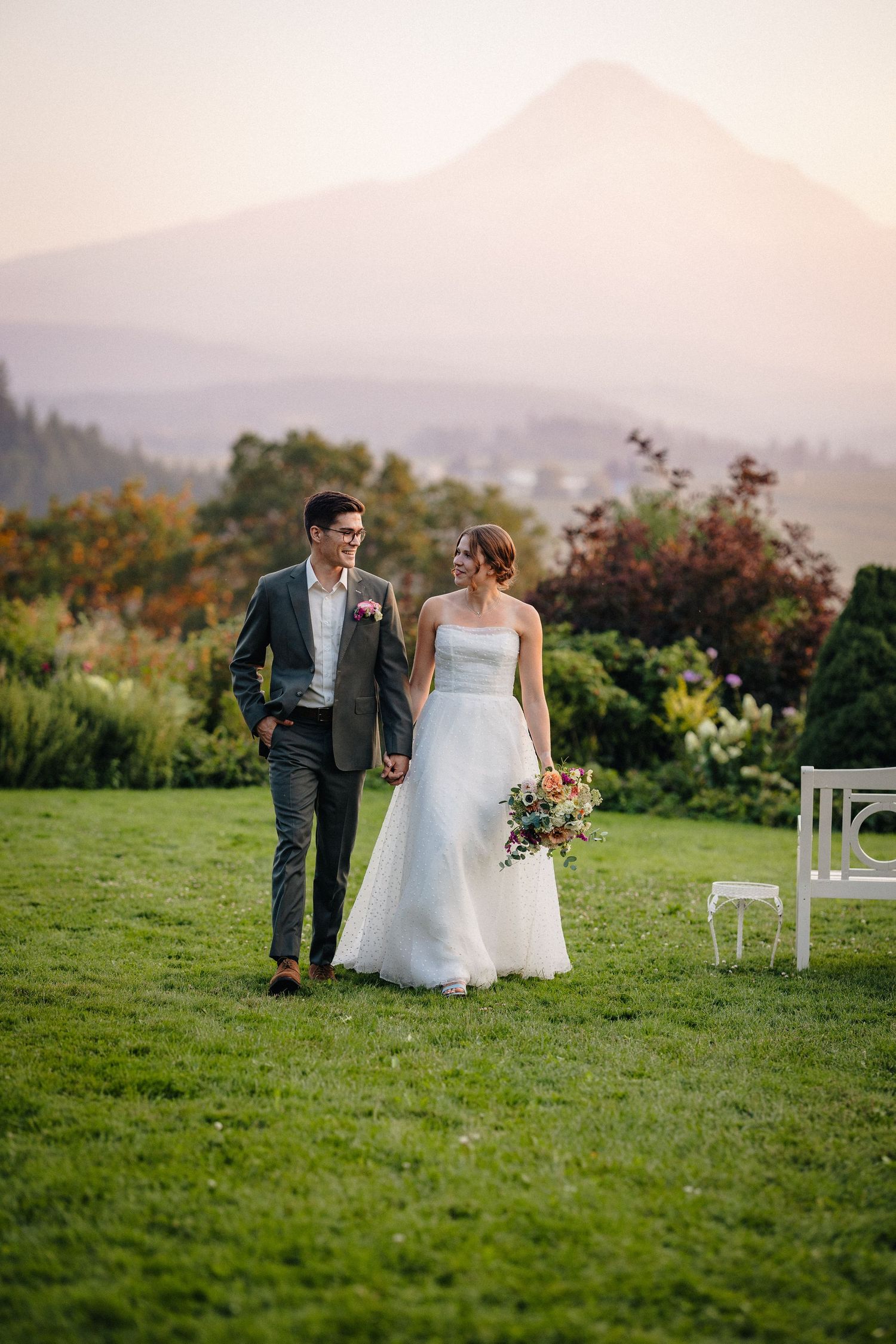 Bride and Groom posing in front of Mt Hood in Hood River, Oregon wedding venue Mt Hood Organic Farms