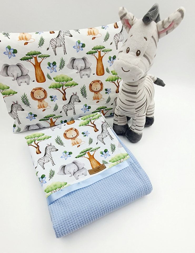 Baby bedding set with cute animal print fabric and light blue waffle texture blanket displayed in multiple angles.