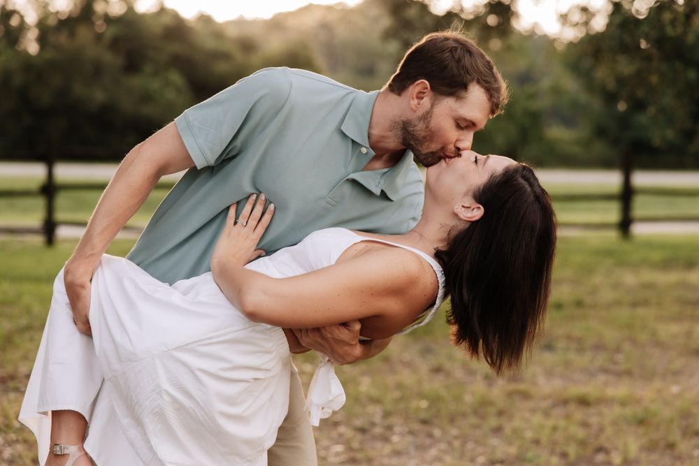 A series of romantic sunset photos showing a couple embracing and sharing intimate moments in a grassy field.