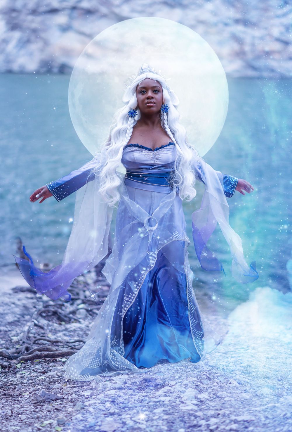 Dramatic fantasy portrait with full moon backdrop and flowing white costume.