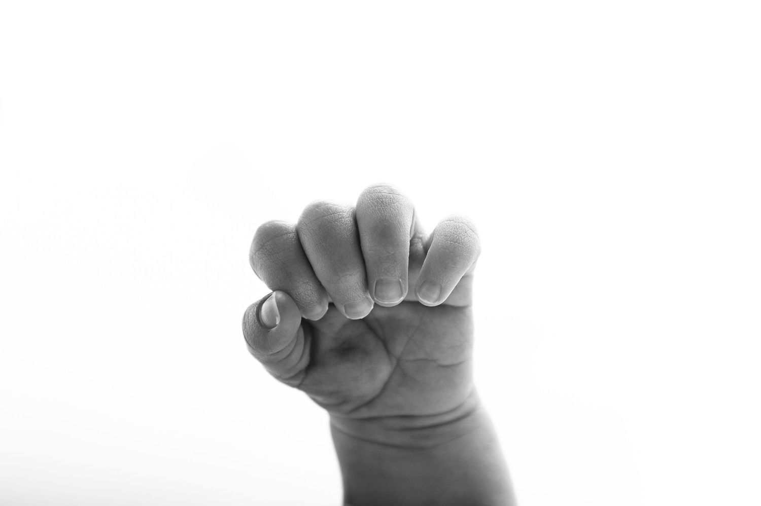 Newborn posing by kara jade photography