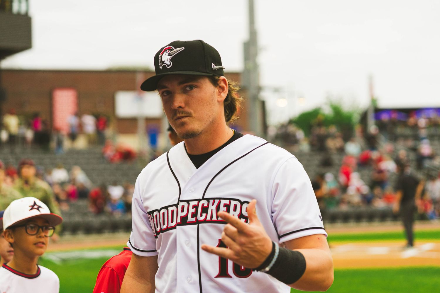Minor league baseball player in Chukars uniform on field during game.