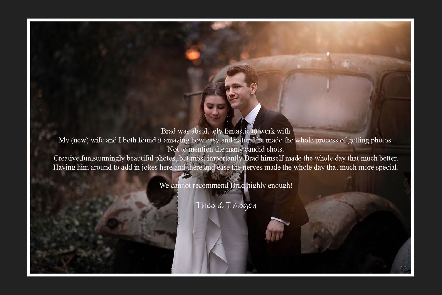 A romantic wedding couple poses in front of a vintage car at dusk.