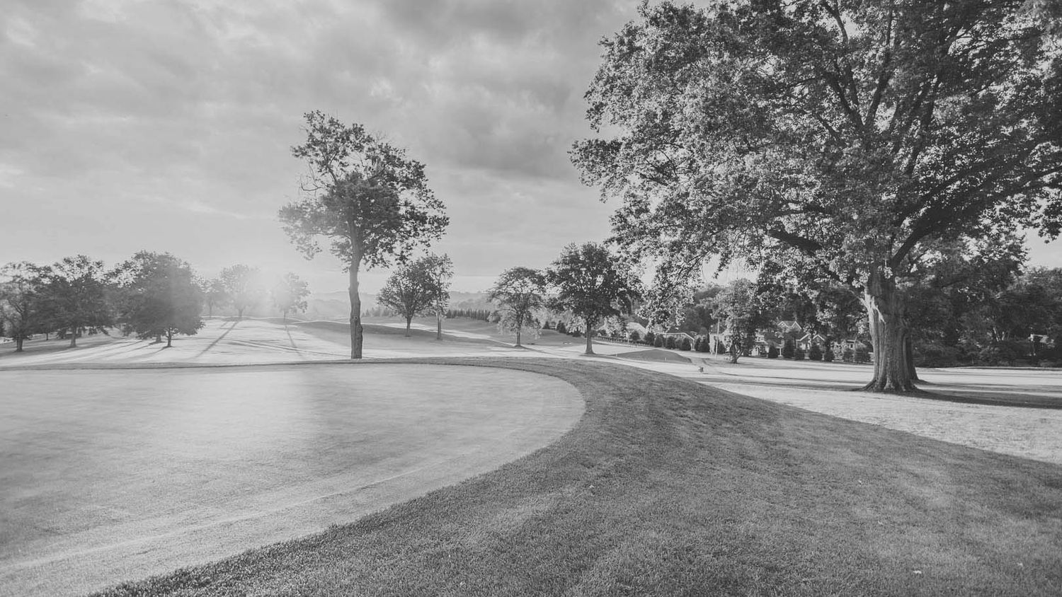 18th hole of a golf course with the sun coming up