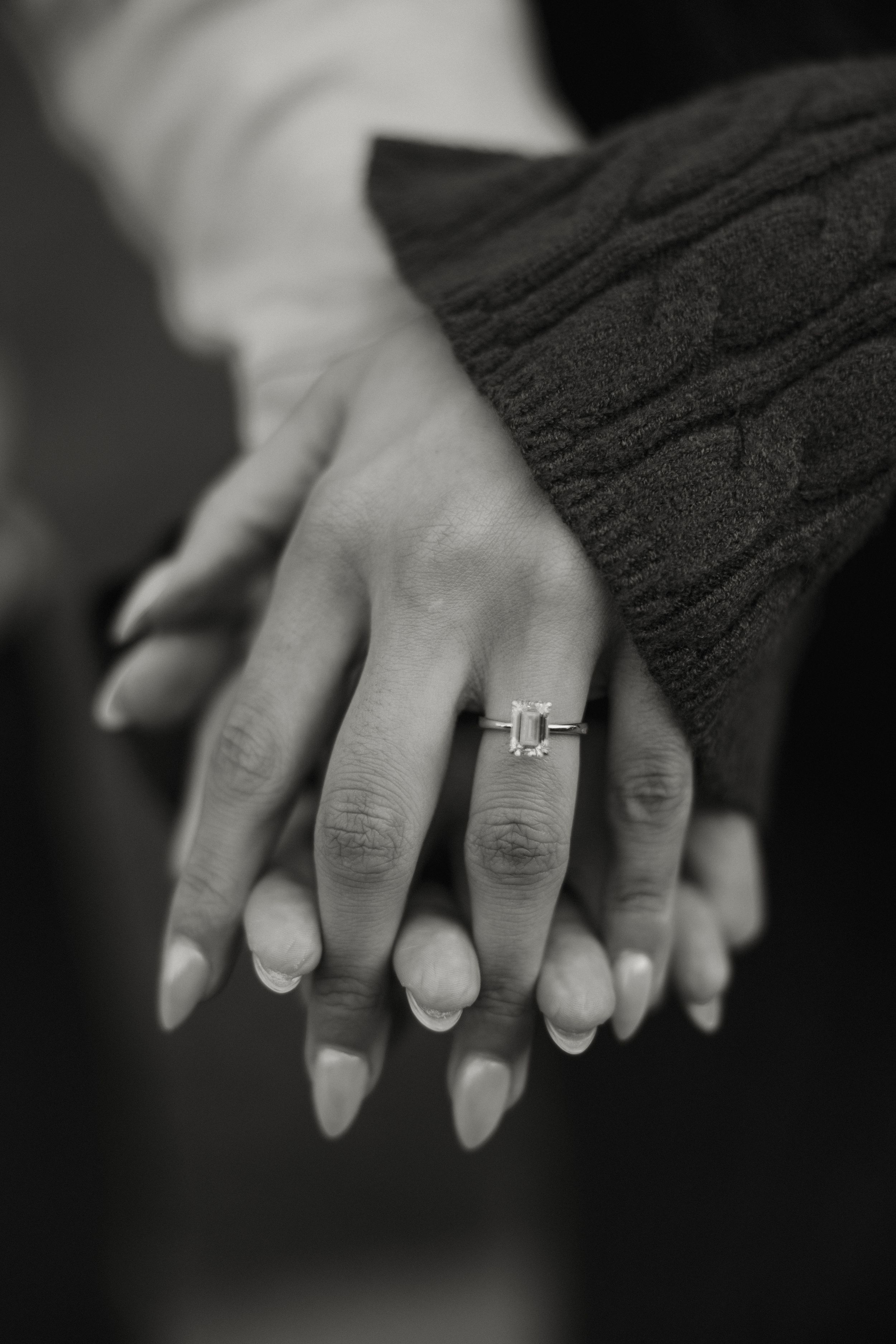 Black and white close-up series showing hands with engagement and wedding rings.