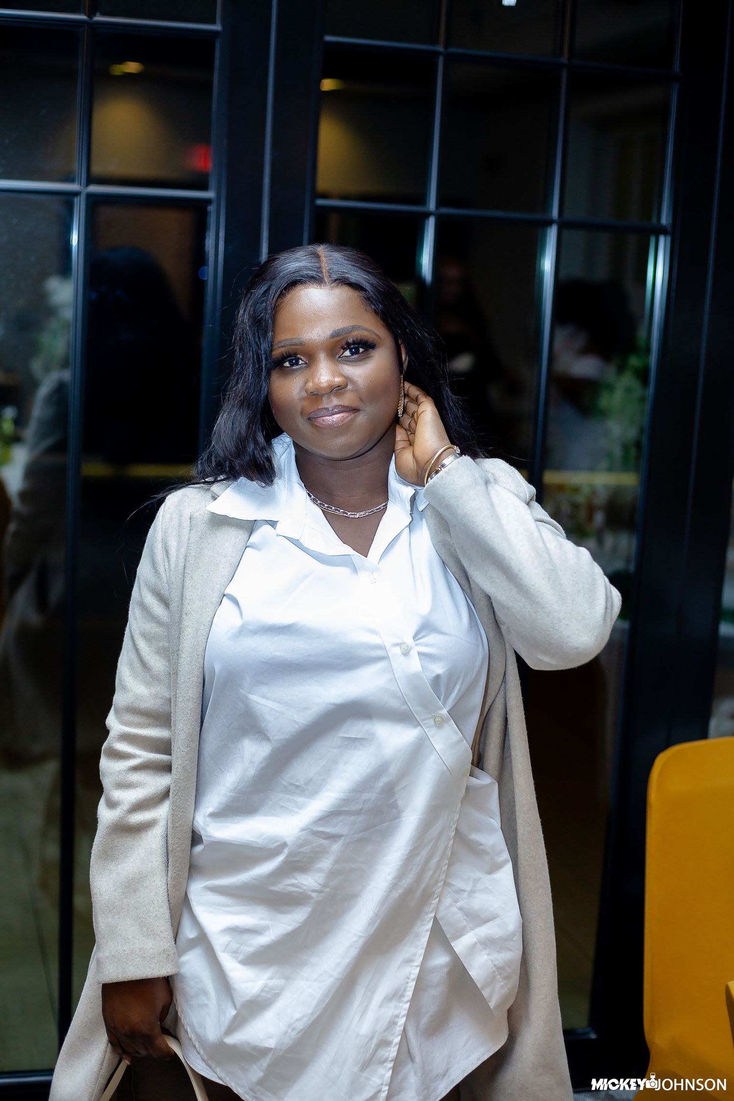 Series of poses showing a person in business attire against a modern office backdrop.