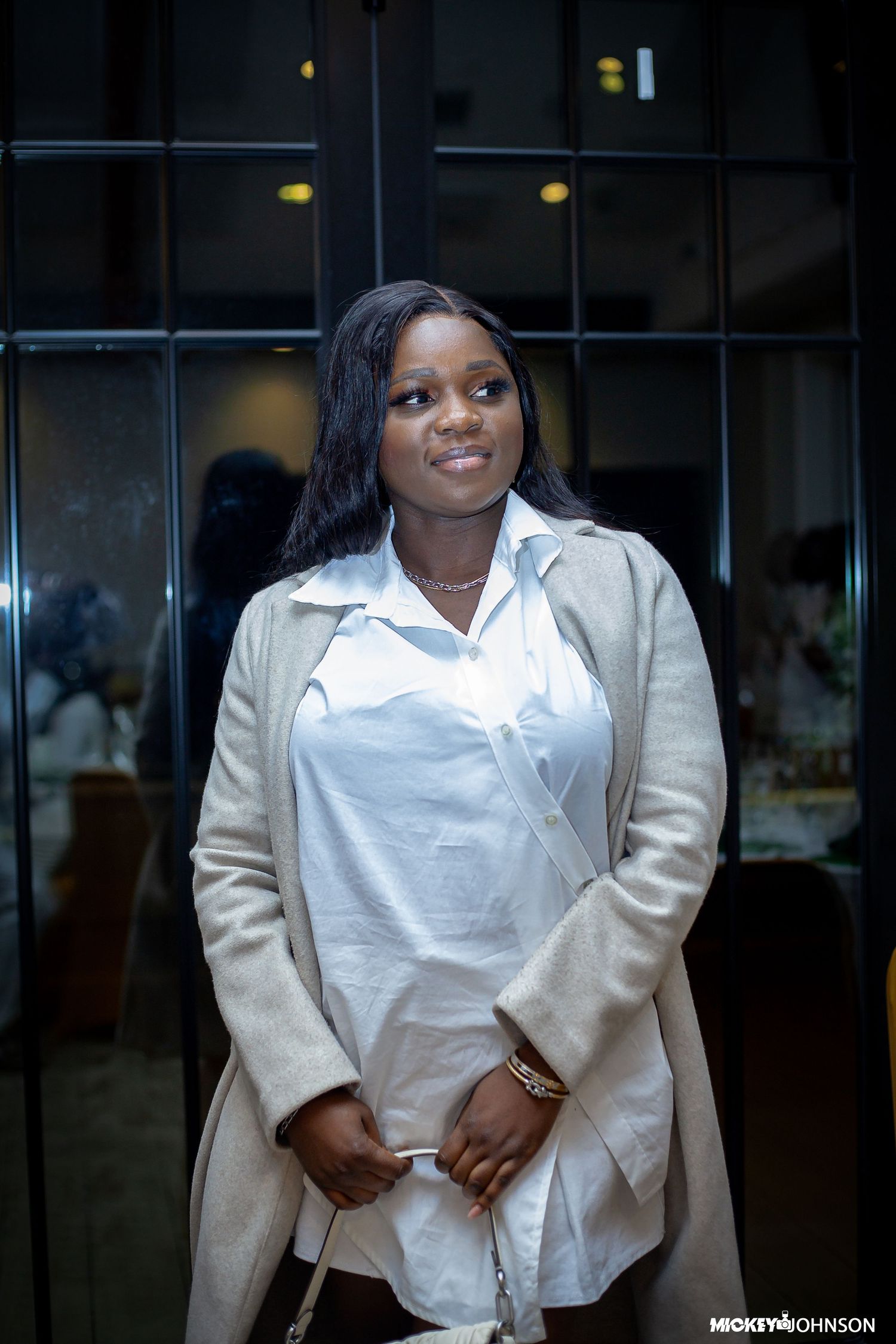 Professional portrait series showing a person in a white blouse and beige blazer against a dark background.