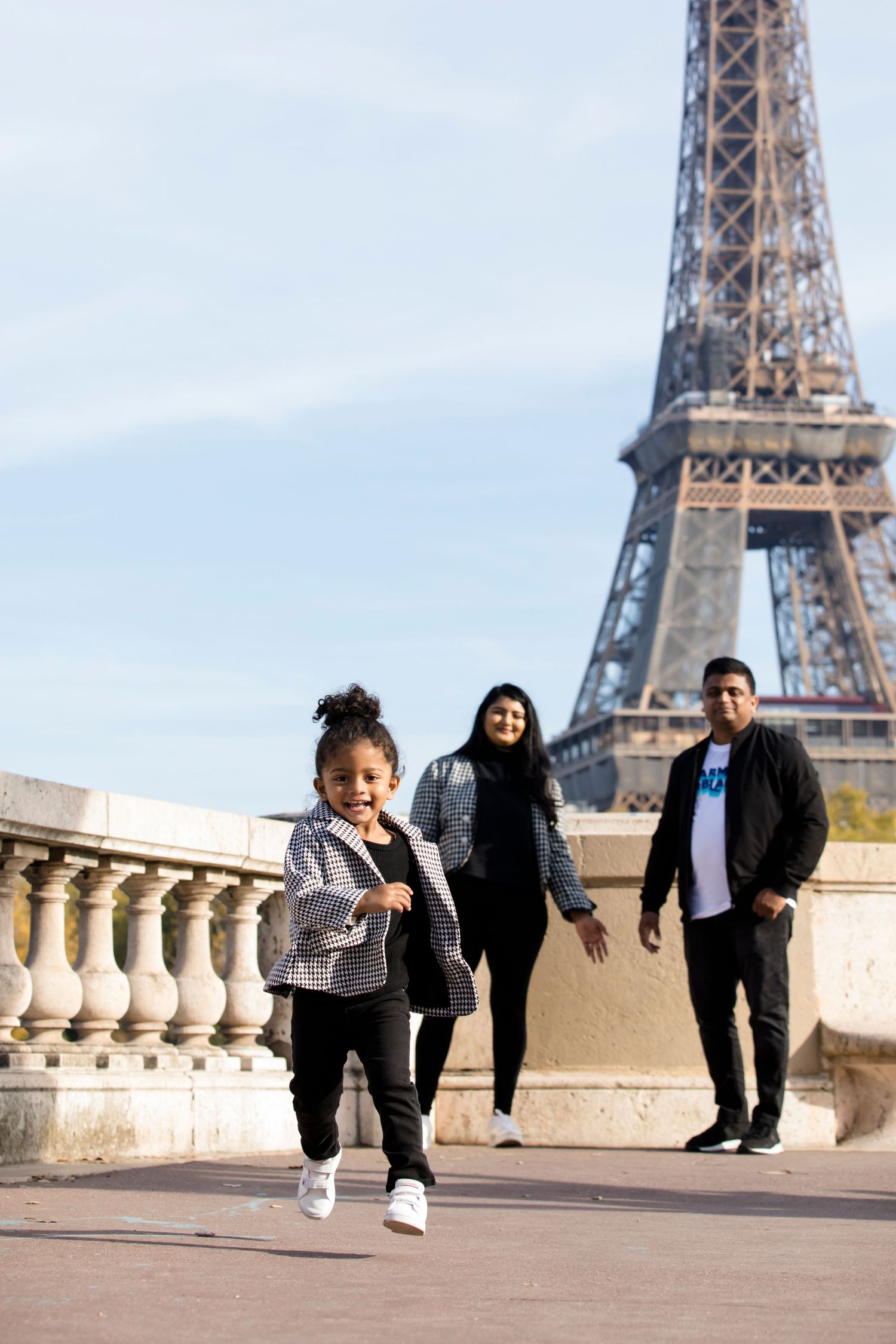 Fun family photoshoot at the Eiffel Tower with Julien LB Photography.