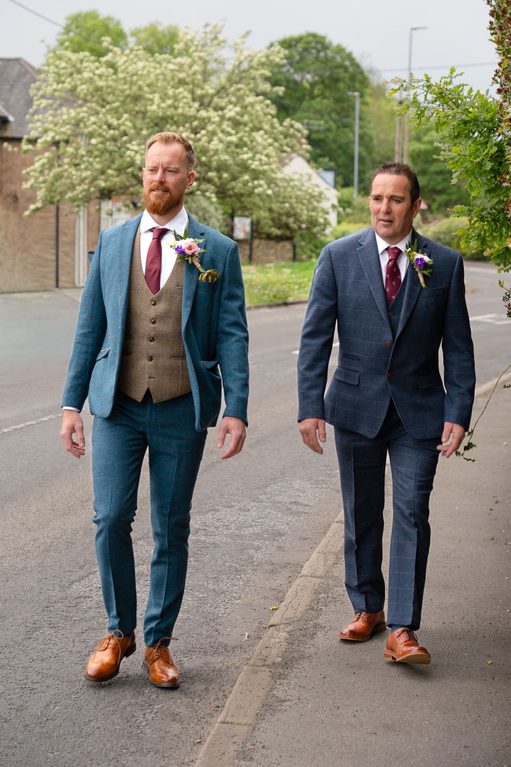 The groom and his dad walking to St Oswald's  church in Bollington to prepare for the wedding ceremony.