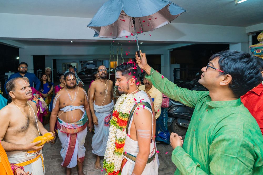 Traditional wedding celebration with men in traditional attire dancing.