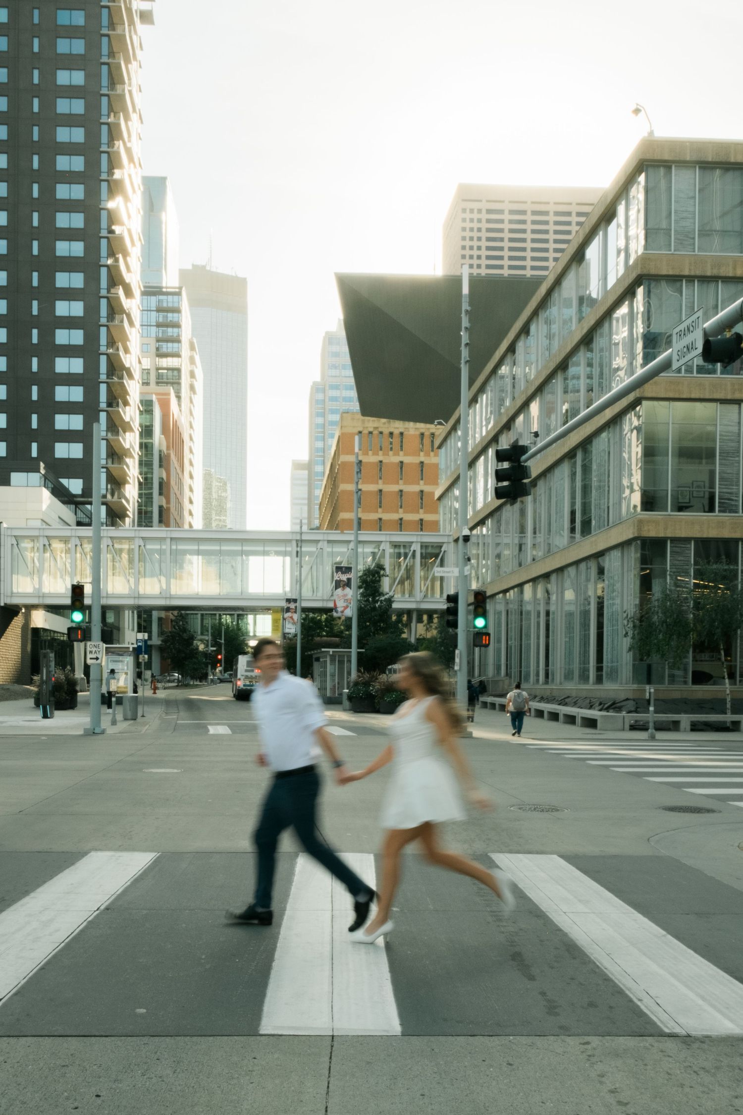 A motion blur photo during a couple's engagement session running in Minneapolis