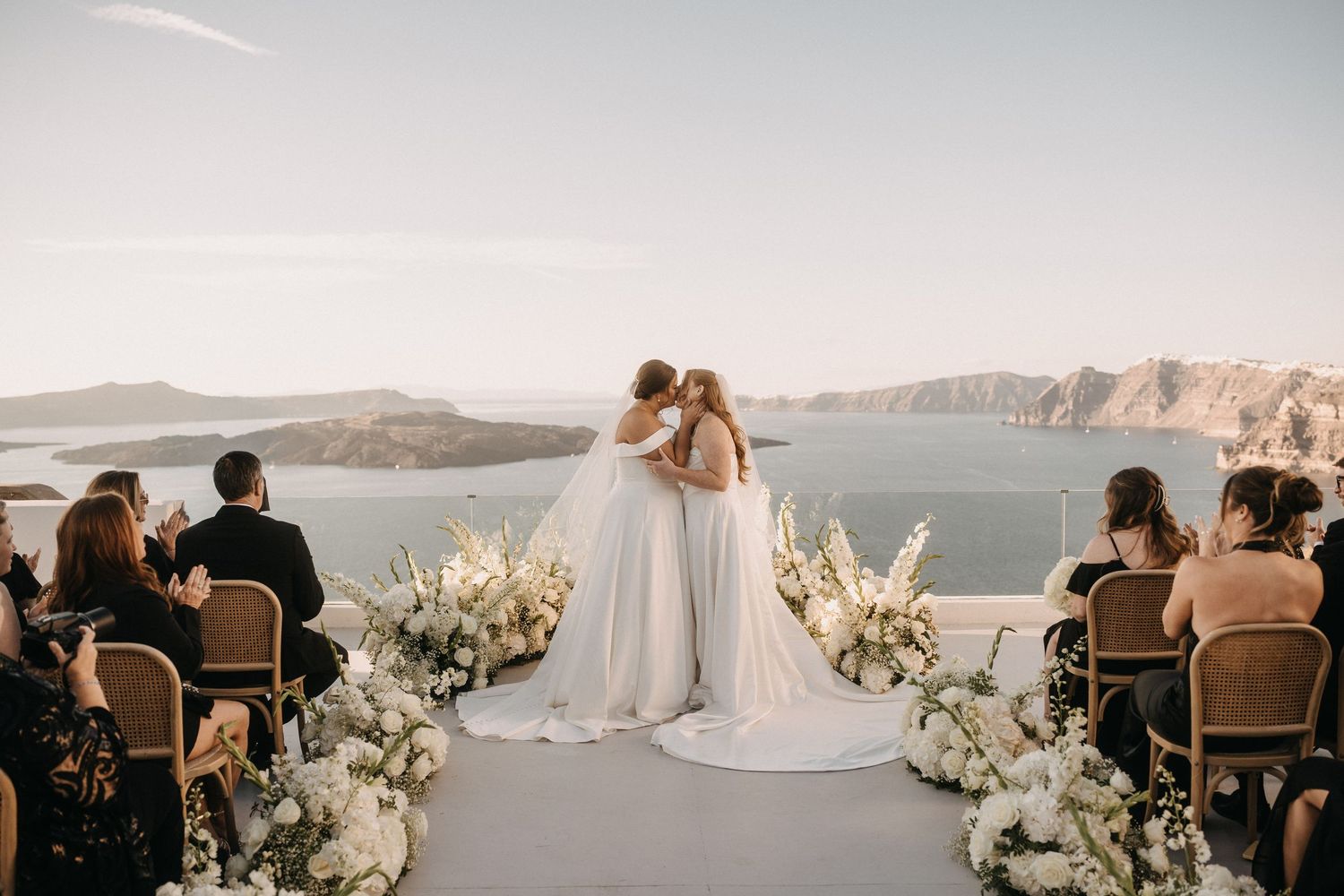 Elegant wedding venue with crystal chandeliers and ornate architectural details.