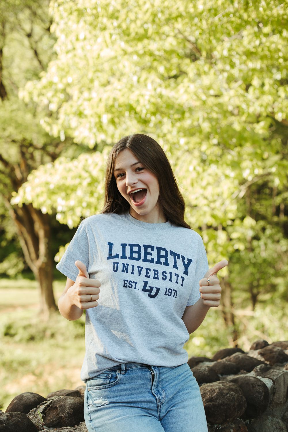 Candid portrait showing school spirit in Liberty University branded apparel.