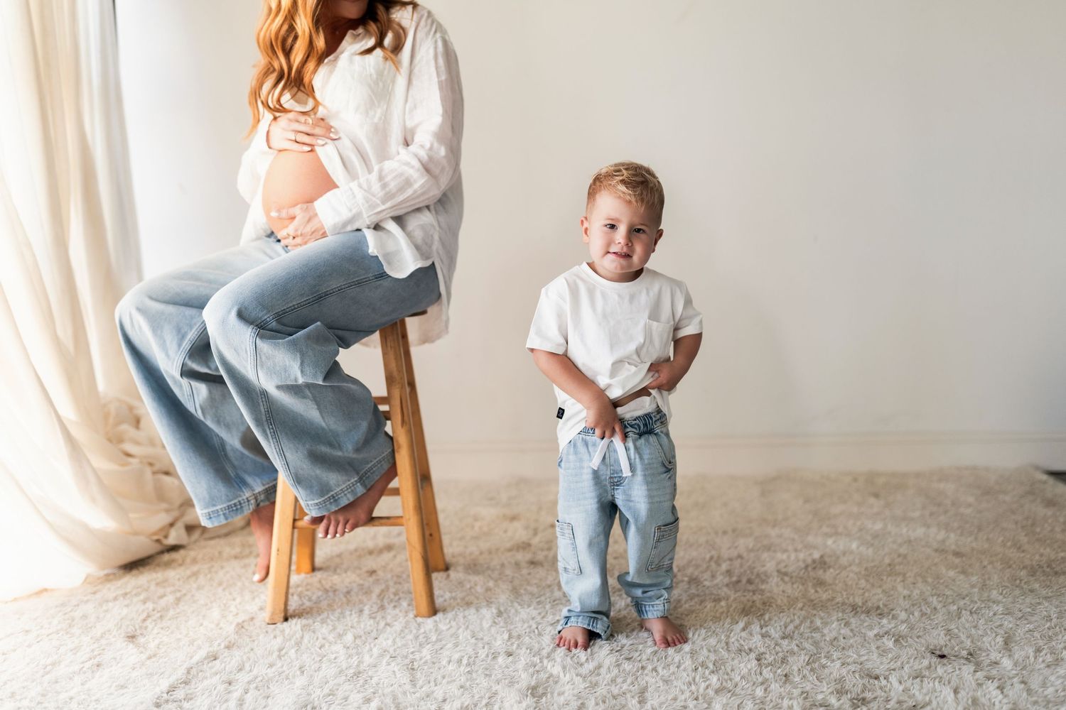 A series of photos showing someone sitting in jeans and white shirt on a wooden stool against a light background.