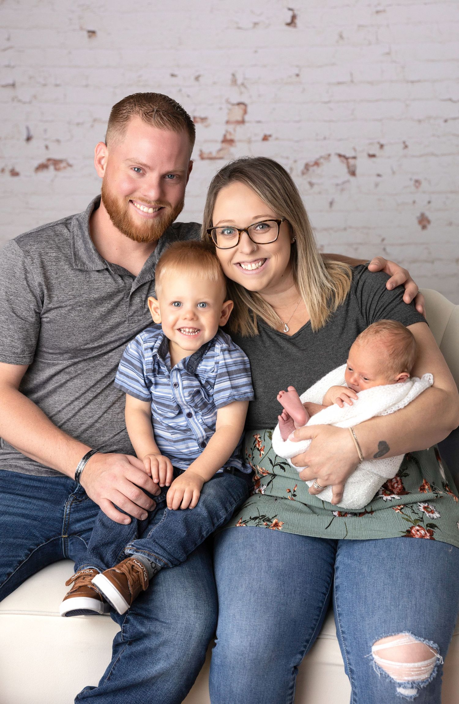 Casual family portrait series on white couch showing relaxed moments together.