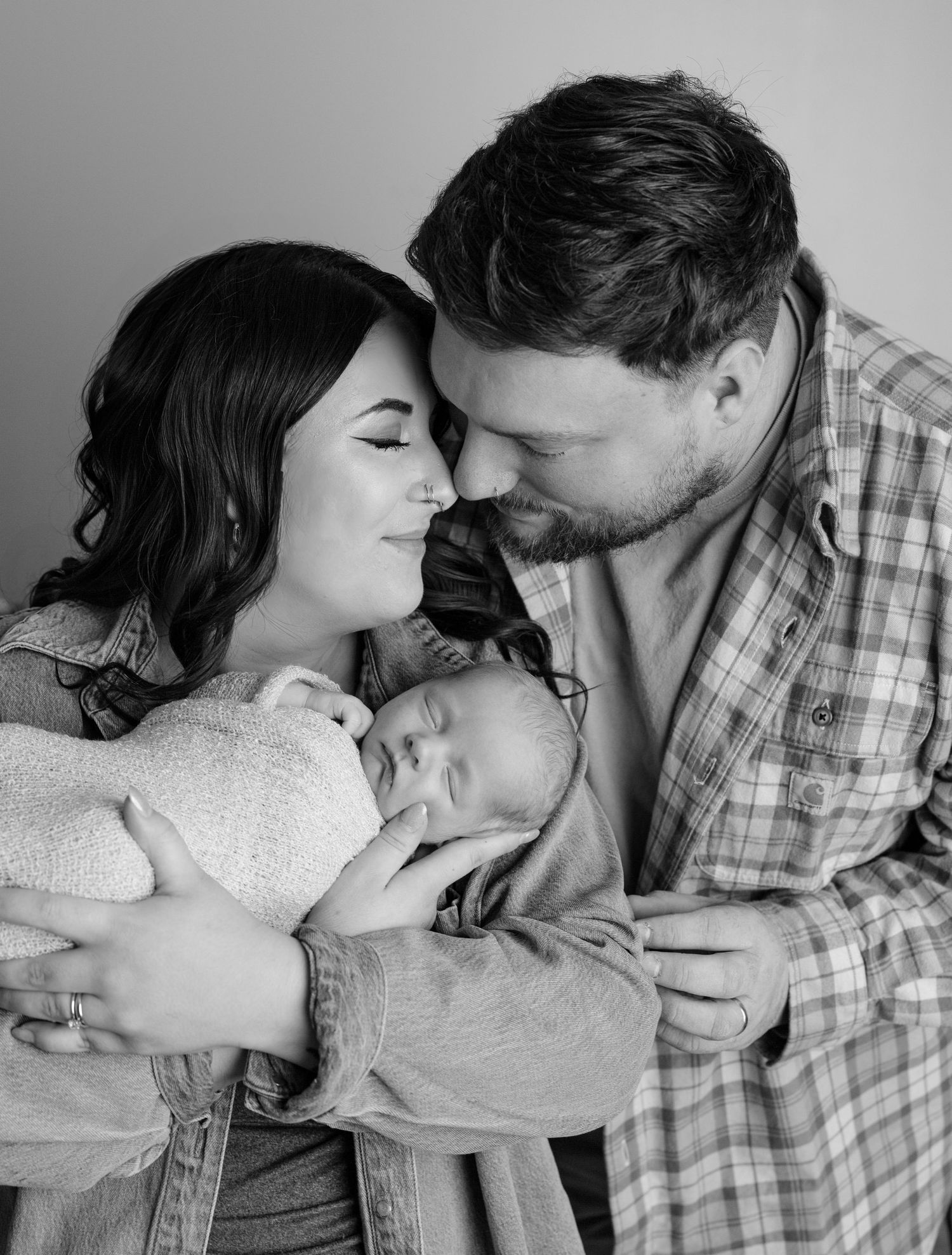 Romantic couple photography sequence showing intimate moments and tender embraces against a light background.