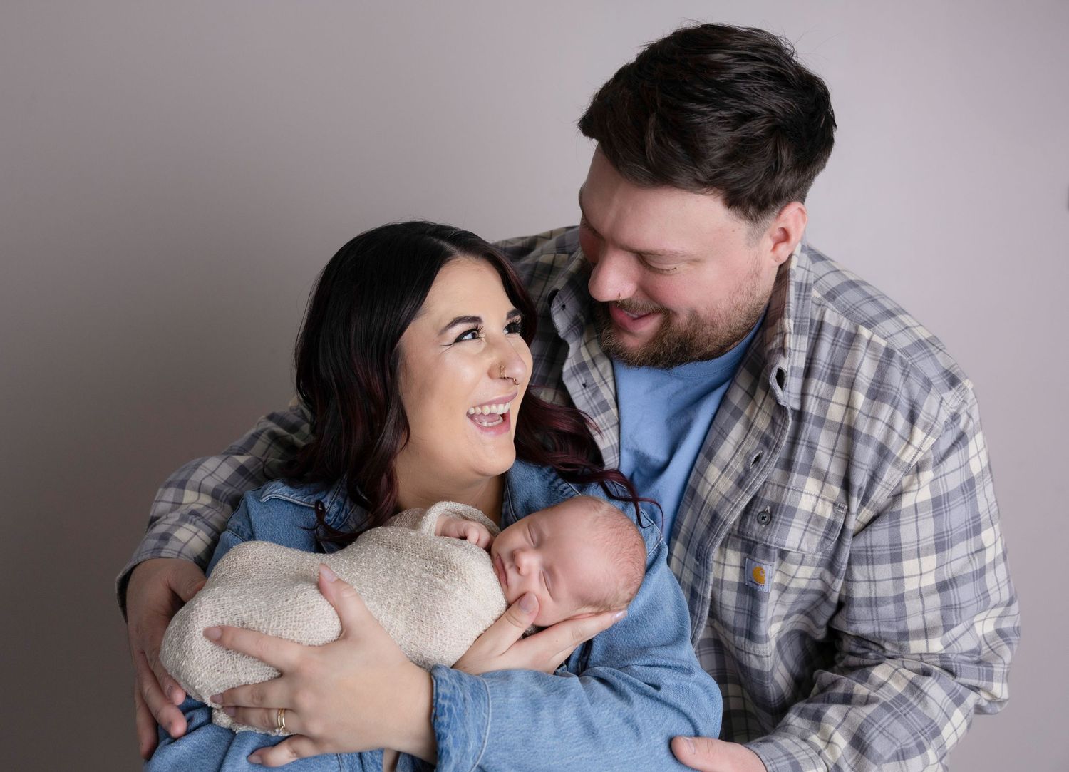 Loving couple shares playful and affectionate moments in a professional photo series.